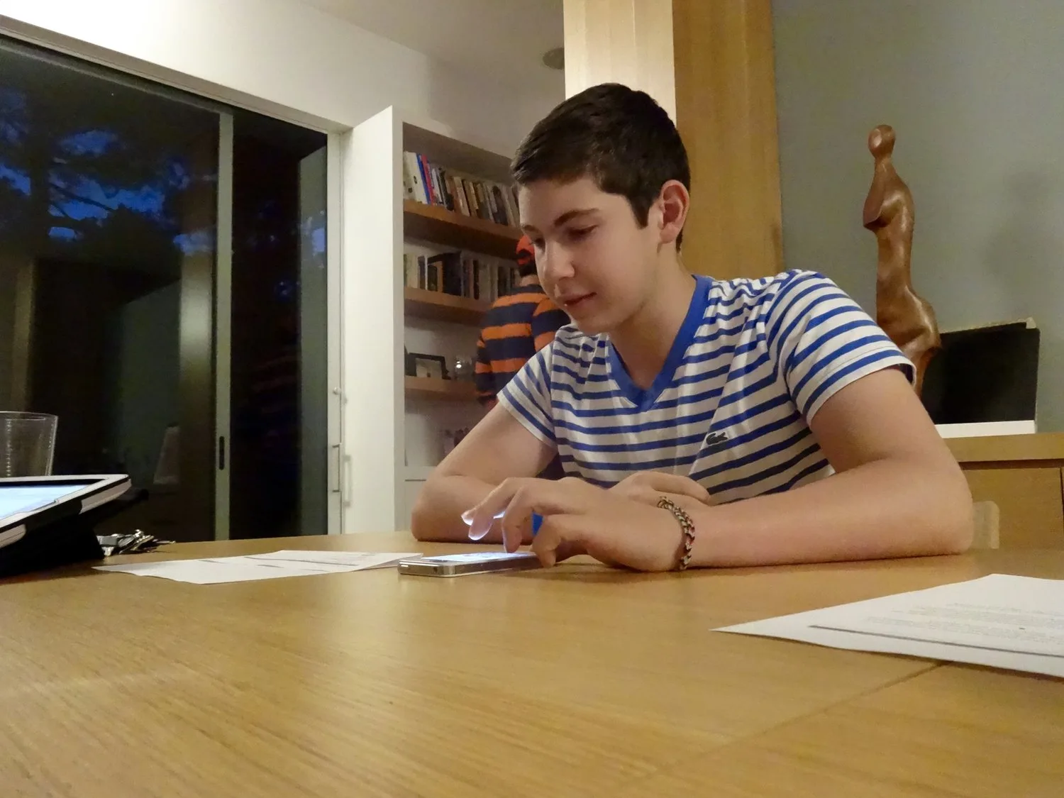 A teenager using the Kurbo app on an iPhone during a testing session